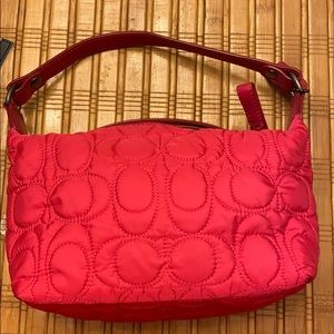 Small pink Coach handbag great for a night out.